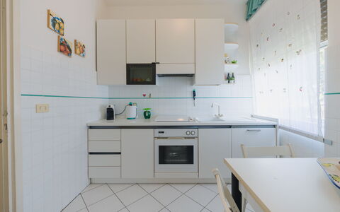 Appartamento la Terrazza di Anna: Kitchen, Kitchen Appliance, Countertop, Flooring, Major Appliance, Interior Design, Cabinetry, Furniture, Floor, Lighting