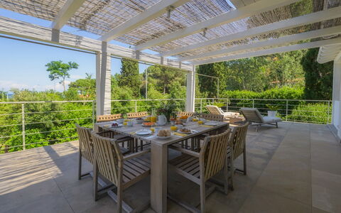 Villa Giomoa 8: Furniture, Wood, Chair, Outdoor Furniture, Table, Outdoor Table, Porch, Kitchen & Dining Room Table, Shade, Outdoor Structure