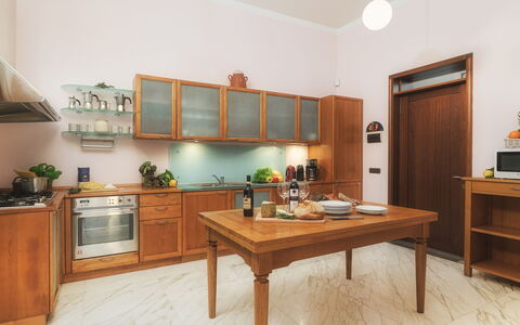 Villa Croci 12: Cabinetry, Flooring, Furniture, Wood, Kitchen, Countertop, Kitchen Appliance, Interior Design, Cupboard, Floor