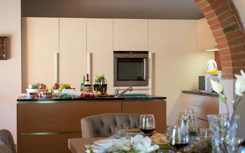 La Villa Nell'Isola Verde 12: Furniture, Interior Design, Flooring, Wood, Countertop, Kitchen, Cabinetry, Ceiling, Kitchen Appliance, Table