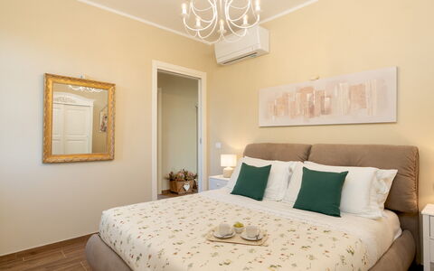 Villino Ariachiara 6: Furniture, Bed, Interior Design, Bedroom, Wall, Floor, Wood, Room, Flooring, Ceiling