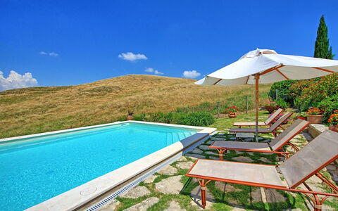 Castelmuzio: Property, Swimming Pool, House, Real Estate, Vacation, Building, Villa, Resort, Leisure, Sunlounger