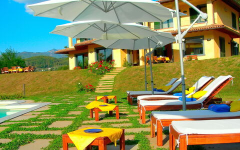 Villa Saida: Resort, Property, Umbrella, Outdoor Furniture, Leisure, Sunlounger, Building, Table, Vacation, House