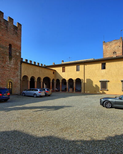 Certaldo: Town, Blue, Property, Building, Vehicle, Car, Luxury Vehicle, Wall, Architecture, Human Settlement