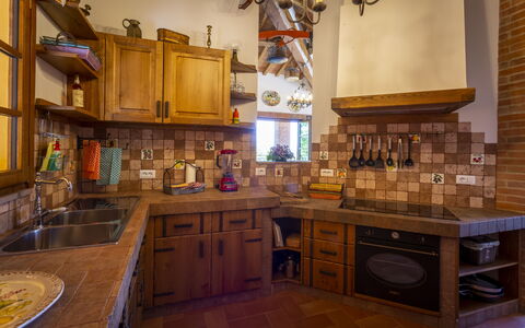 Villa Amadeo: Countertop, Cabinetry, Room, Furniture, Property, Kitchen, Interior Design, Building, House, Floor