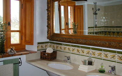 Bathroom with washbasin in real travertine
