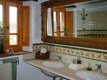 Bathroom with washbasin in real travertine