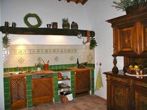 Kitchen with electric stove and dishwasher and living area