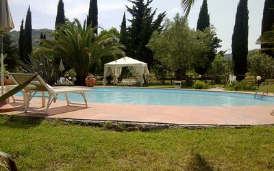 Suvereto: Swimming Pool, Property, Resort, Vacation, Palm Tree, Tree, Grass, Leisure, Real Estate, House