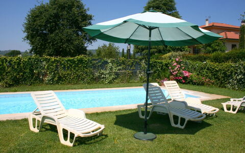Casa Clementina: Water, Plant, Furniture, Sky, Green, Umbrella, Shade, Tree, Sunlounger, Outdoor Furniture