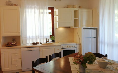 Villa La Quercia: Furniture, Interior Design, Wood, Flooring, Lighting, Room, Kitchen, Cabinetry, Kitchen Appliance, Kitchen & Dining Room Table