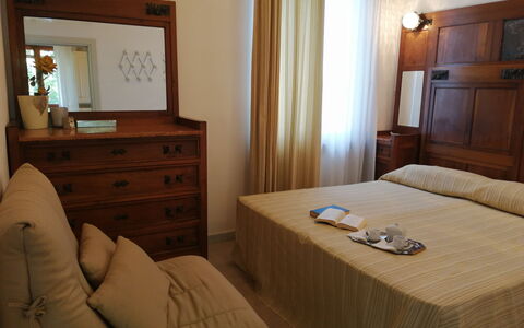 Villa La Quercia: Furniture, Wood, Bedroom, Interior Design, Bed, Floor, Flooring, Bed Sheet, Room, Bedding