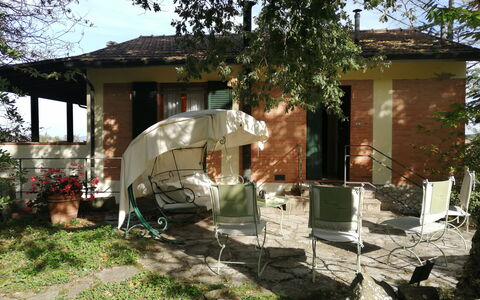 Villa La Quercia: Furniture, Chair, Outdoor Furniture, Table, Shade, Backyard, Outdoor Table, Garden, Cottage, Umbrella