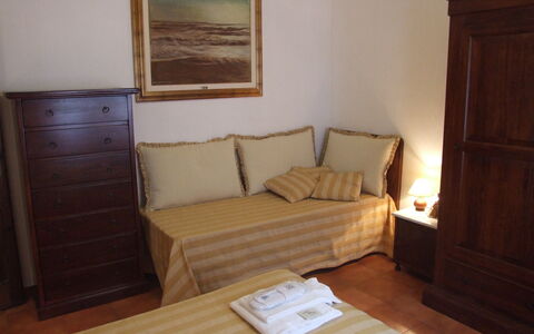 Villa Il Castagno: Furniture, Room, Floor, Property, Hardwood, Bedroom, Wall, Bed, Wood Stain, Interior Design